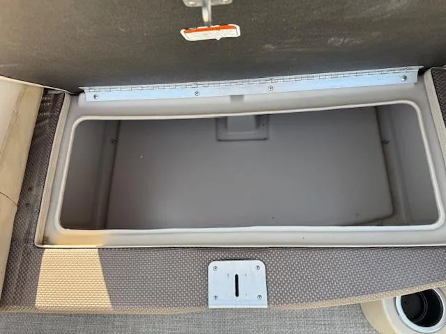 Slide: The Image of Open storage compartment in 2016 Regency 254 DL3 boat. - 29