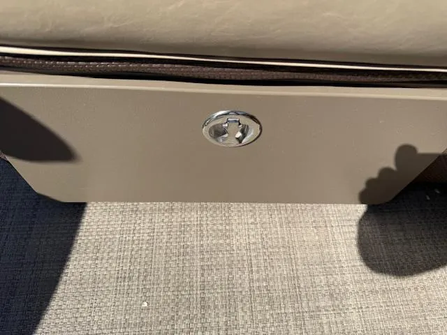 Slide: The Image of Storage compartment in 2016 Regency 254 DL3 boat, featuring a sleek design and secure latch. - 33