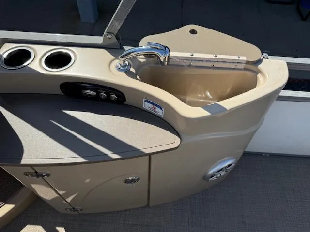 Slide: The Image of 2016 Regency 254 DL3 boat sink with faucet and cup holders. - 8