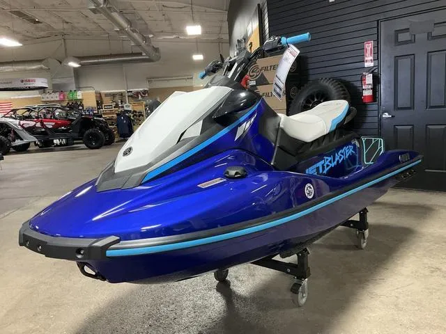 Slide: The Image of 2024 Yamaha Waverunner Jetblaster in showroom, vibrant blue color, sleek design. - 4