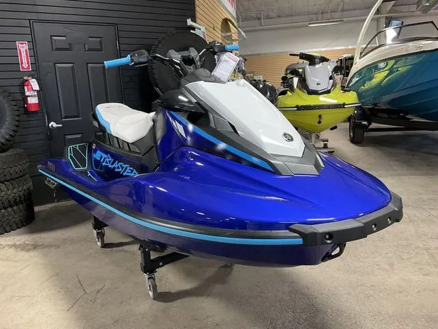 Slide: The Image of 2024 Yamaha Waverunner Jetblaster in showroom, vibrant blue color, sleek design. - 5