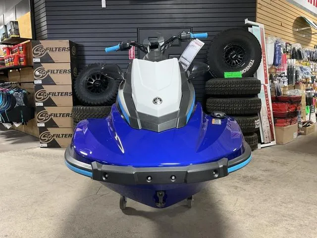 Slide: The Image of 2024 Yamaha Waverunner Jetblaster in showroom, blue and white design, surrounded by tires and accessories. - 6
