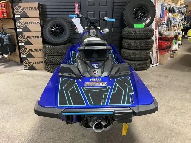 Slide: The Image of 2024 Yamaha Waverunner Jetblaster in showroom, vibrant blue design, surrounded by tires and filters. - 7