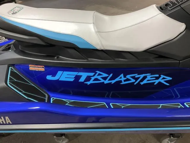 Slide: The Image of 2024 Yamaha Waverunner Jetblaster, blue and white design, side view of seat and branding. - 8