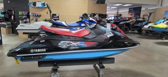 Slide: The Image of 2024 Yamaha Waverunner EX Sport jet ski displayed in showroom. - 4