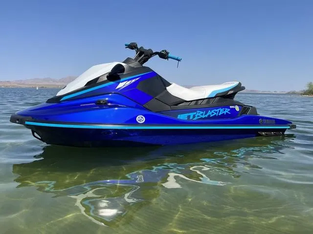 Slide: The Image of 2024 Yamaha Waverunner Jetblaster in blue, floating on clear water under a clear sky. - 4