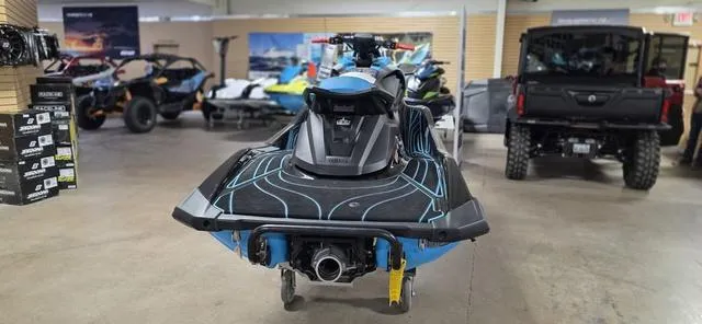 Slide: The Image of 2024 Yamaha Waverunner GP in showroom, rear view, surrounded by other vehicles. - 3