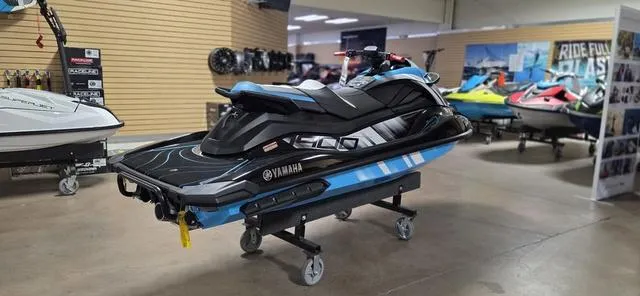Slide: The Image of 2024 Yamaha Waverunner GP in showroom, sleek design, blue and black color scheme. - 4