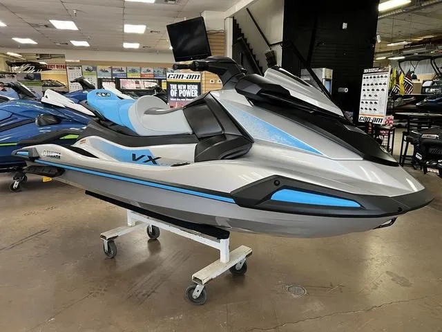 Slide: The Image of 2024 Yamaha Waverunner VX in showroom, sleek design with blue and silver accents. - 2