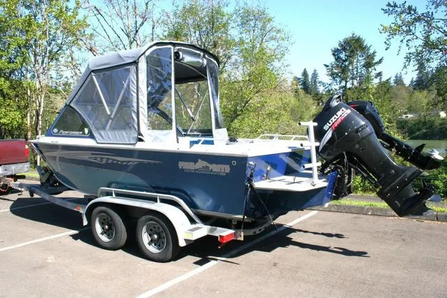 Slide: The Image of 2008 Fish Rite 20 Performer boat with Suzuki outboard motor on a trailer in a parking lot. - 3