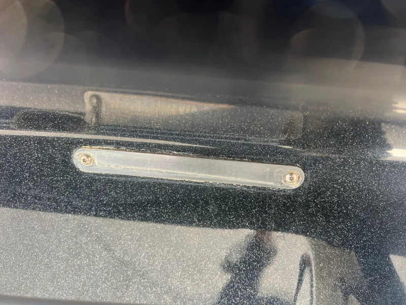 Slide: The Image of Close-up of a 2016 Centurion Carbon Pro boat's metallic detail. - 12