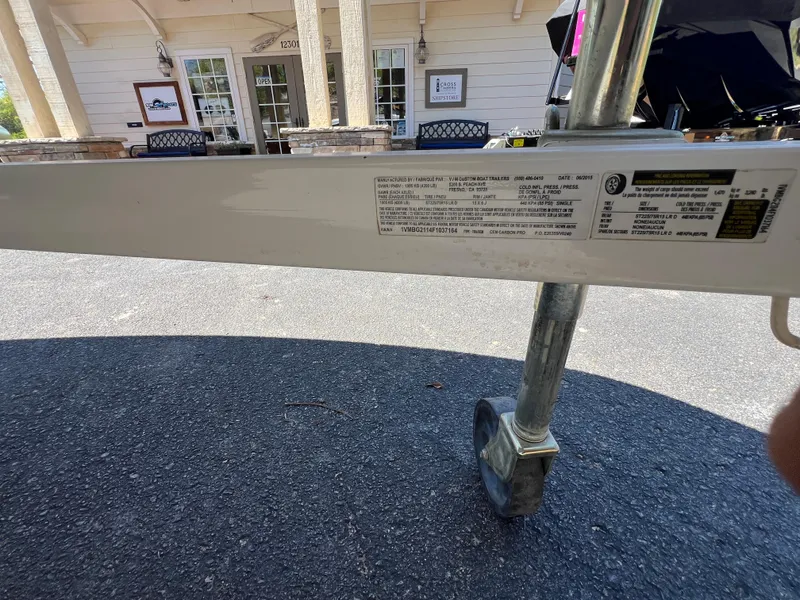 Slide: The Image of Trailer with Centurion Carbon Pro label, parked on asphalt near a building, 2016 model. - 16