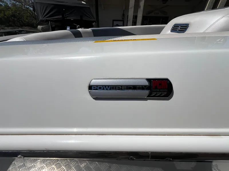 Slide: The Image of 2016 Centurion Carbon Pro boat with PowerFlex HC emblem on white exterior. - 20