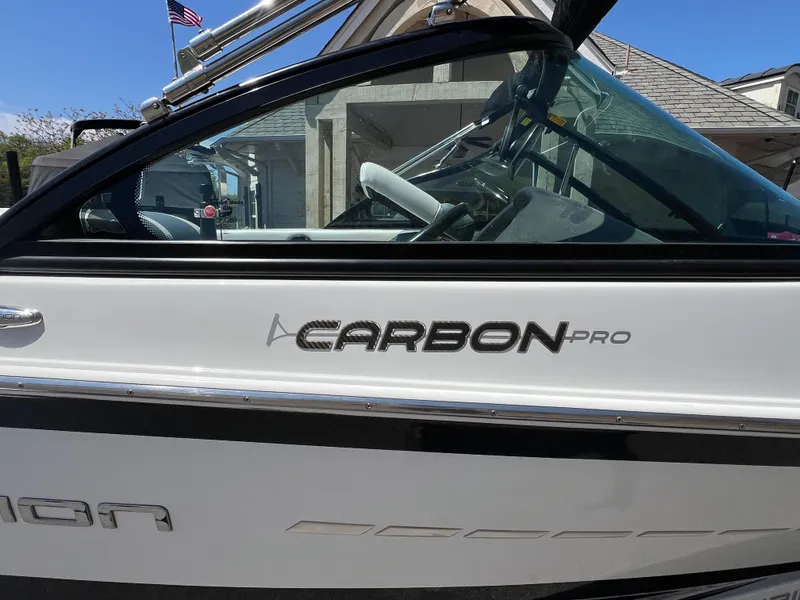 Slide: The Image of 2016 Centurion Carbon Pro boat side view with logo and sleek design. - 7