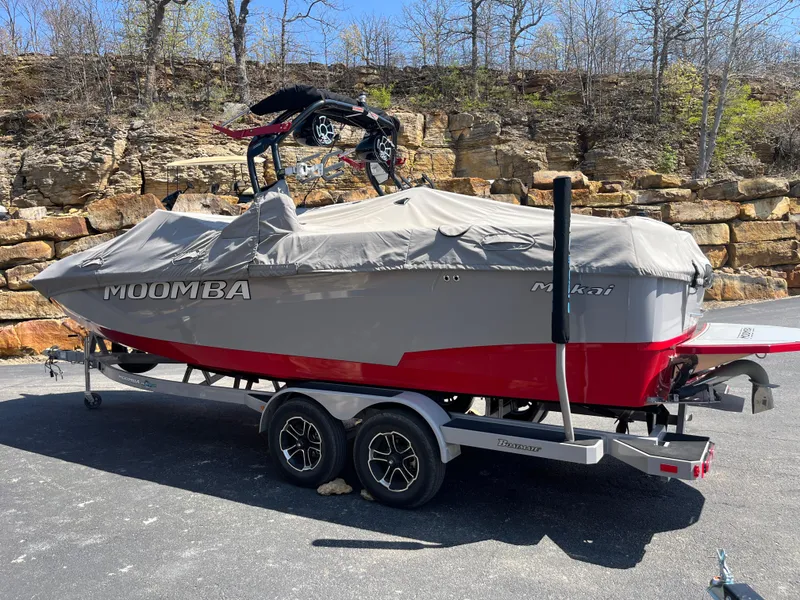 Slide: The Image of 2022 Moomba Makai boat on trailer, covered, parked outdoors. - 11
