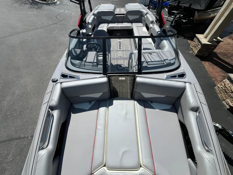 Slide: The Image of 2022 Moomba Makai boat interior with gray seating and sleek design. - 14