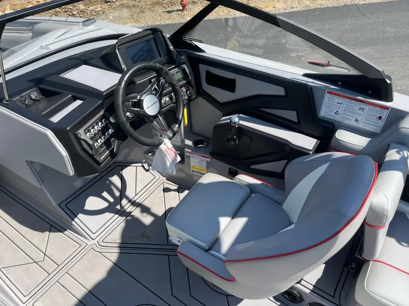 Slide: The Image of 2022 Moomba Makai boat interior with modern dashboard and steering wheel. - 16