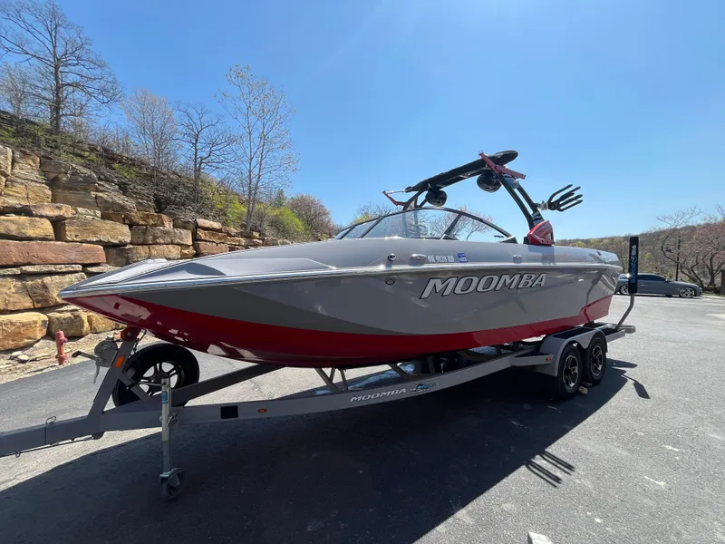 Slide: The Image of 2022 Moomba Makai boat on trailer, parked outdoors under clear blue sky. - 3