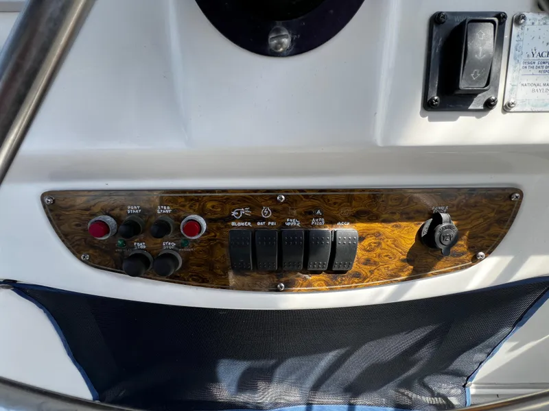 Slide: The Image of Control panel of 2001 Bayliner 3488 Command Bridge Motoryacht with switches and buttons. - 15