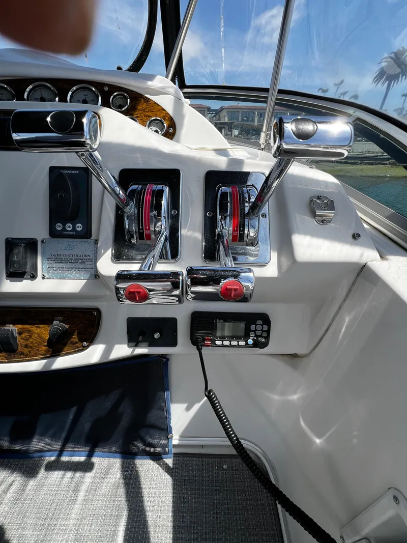 Slide: The Image of Control panel of a 2001 Bayliner 3488 Command Bridge Motoryacht with dual throttle levers. - 17