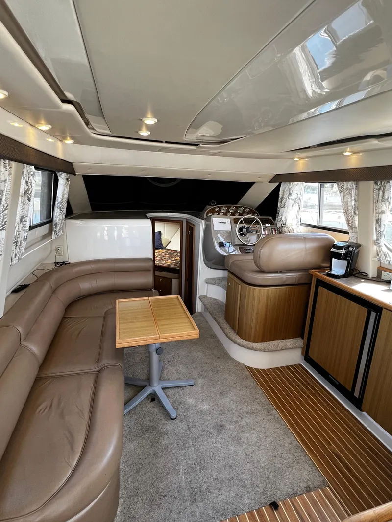 Slide: The Image of Interior of 2001 Bayliner 3488 Command Bridge Motoryacht with leather seating and wooden accents. - 18