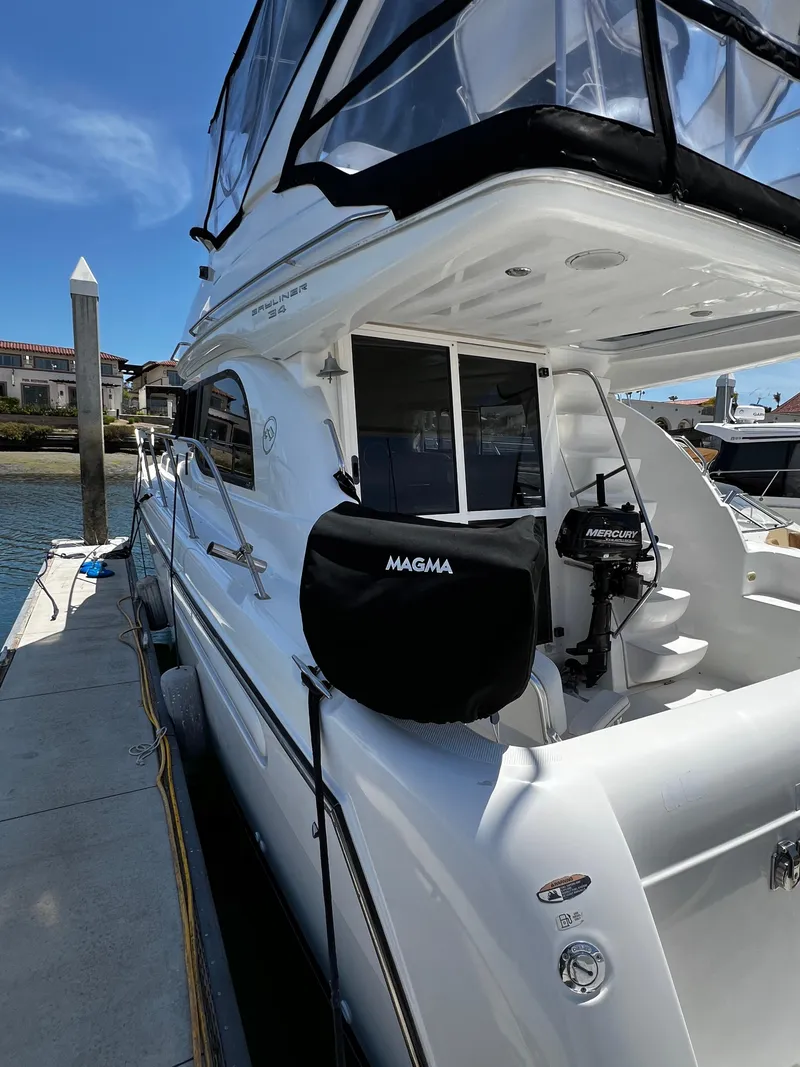 Slide: The Image of 2001 Bayliner 3488 Command Bridge Motoryacht docked at marina. - 2