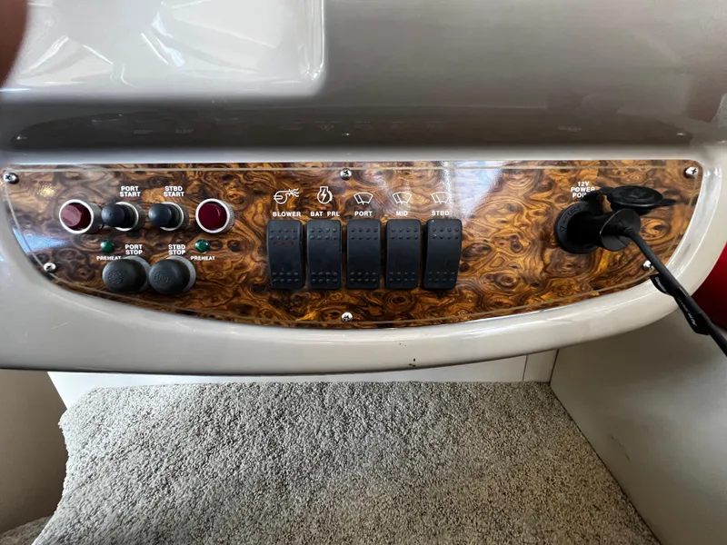 Slide: The Image of Control panel of a 2001 Bayliner 3488 Command Bridge Motoryacht with switches and knobs. - 25
