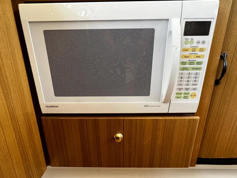 Slide: The Image of Built-in microwave in 2001 Bayliner 3488 Command Bridge Motoryacht kitchen area. - 30