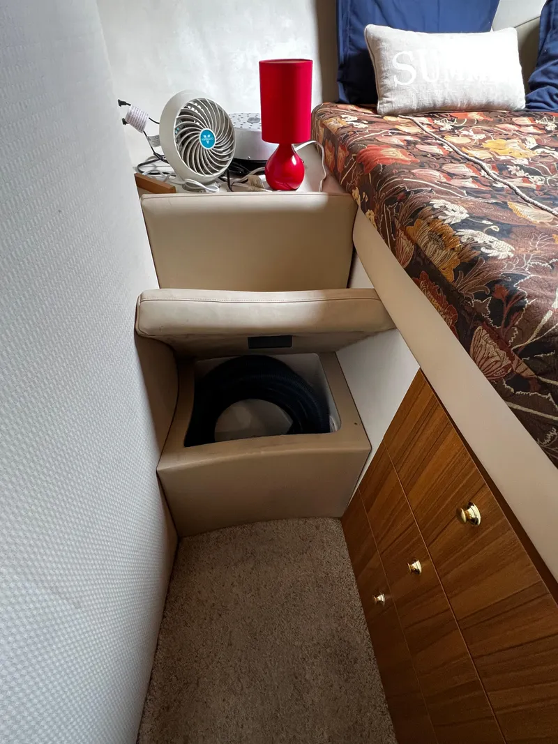 Slide: The Image of Interior of 2001 Bayliner 3488 Command Bridge Motoryacht with bed, fan, and red lamp. - 40