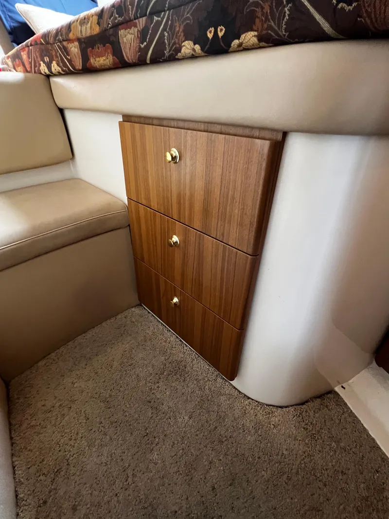 Slide: The Image of Interior of 2001 Bayliner 3488 Command Bridge Motoryacht with wooden drawers and beige seating. - 41