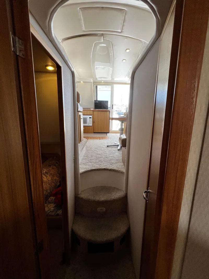 Slide: The Image of Interior view of 2001 Bayliner 3488 Command Bridge Motoryacht, featuring cozy cabin and modern amenities. - 49