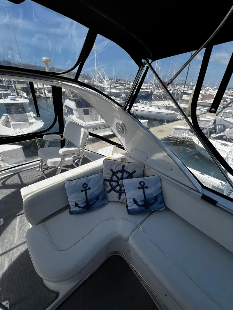 Slide: The Image of 2001 Bayliner 3488 Command Bridge Motoryacht interior with nautical-themed cushions. - 9