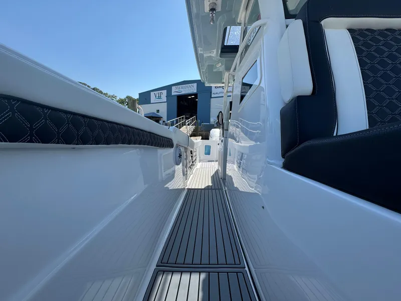 Slide: The Image of 2024 Tidewater 380 CC Adventure boat interior with sleek seating and modern design. - 25