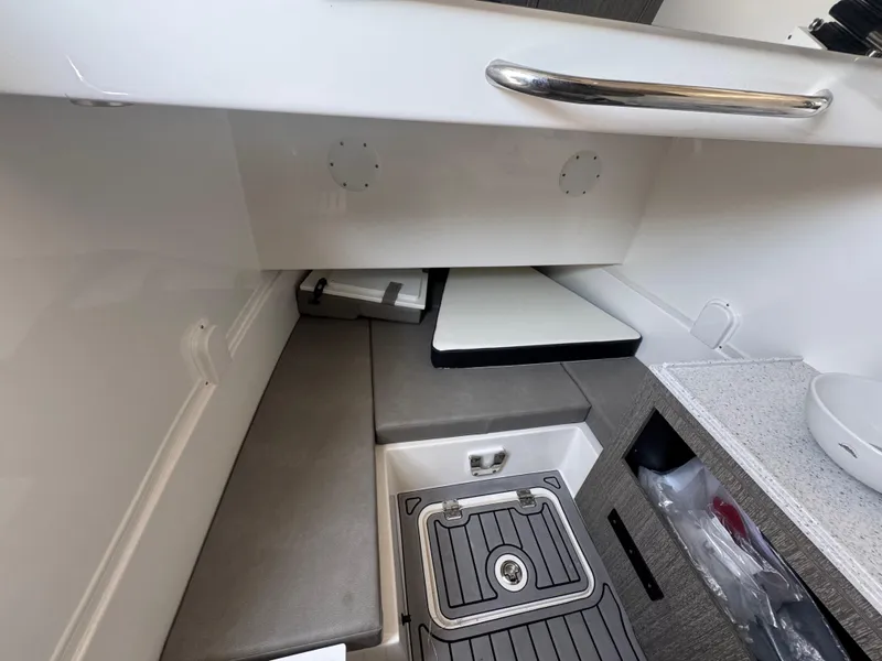 Slide: The Image of 2024 Tidewater 380 CC Adventure cabin interior with seating and storage. - 29