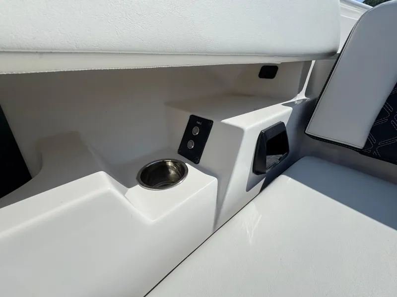 Slide: The Image of 2024 Tidewater 380 CC Adventure boat interior with cup holder and control panel. - 35