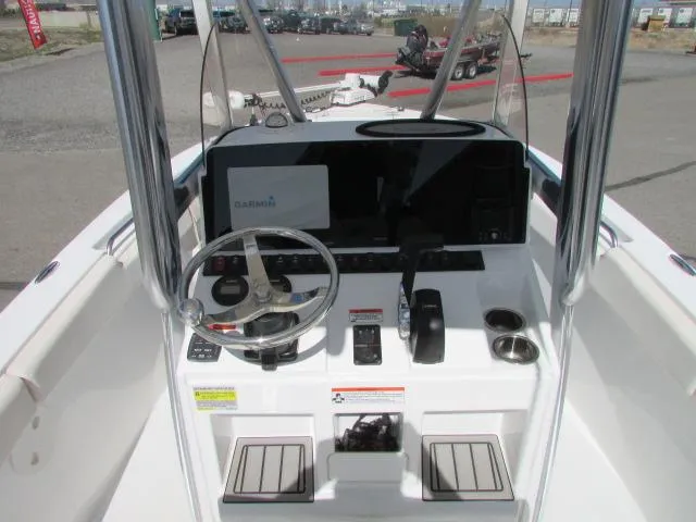 Slide: The Image of 2021 Sea Hunt 219 Ultra boat console with Garmin navigation system and steering wheel. - 15