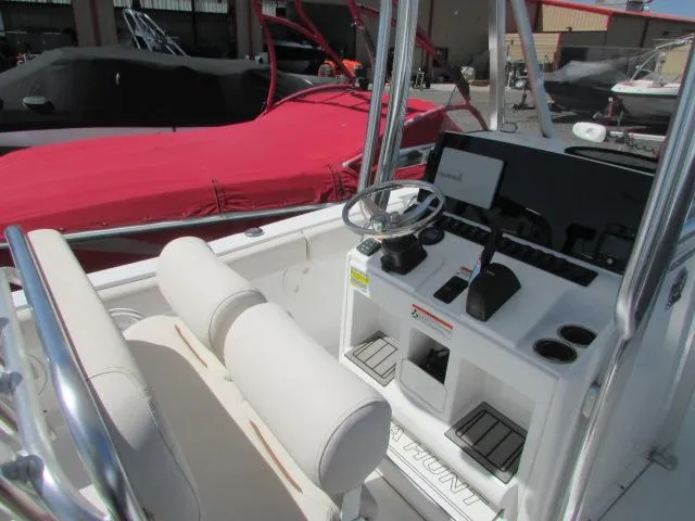 Slide: The Image of 2021 Sea Hunt 219 Ultra boat interior with steering console and seating. - 18