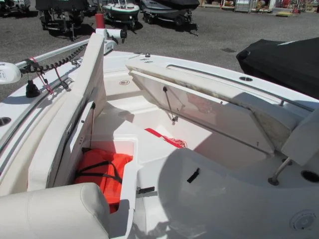 Slide: The Image of 2021 Sea Hunt 219 Ultra boat interior with seating and storage compartments. - 20