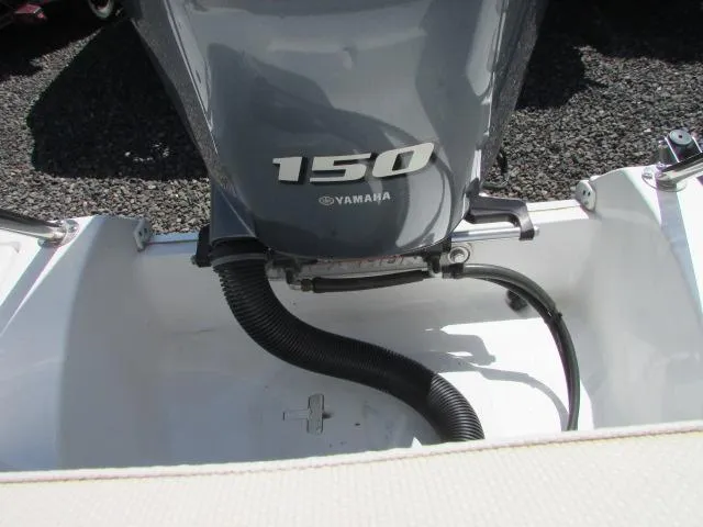 Slide: The Image of Outboard motor on 2021 Sea Hunt 219 Ultra boat, featuring Yamaha 150 engine. - 23