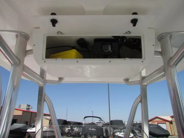 Slide: The Image of 2021 Sea Hunt 219 Ultra boat console with storage compartment and electronics. - 4