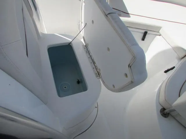 Slide: The Image of 2021 Sea Hunt 219 Ultra boat with open storage compartment. - 5