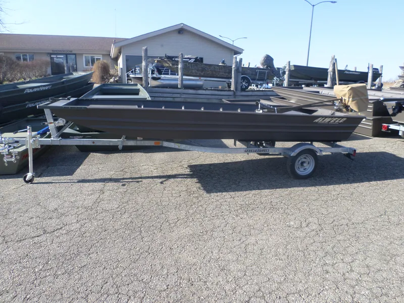 Slide: The Image of 2025 Alweld 1542 Jon boat on trailer in outdoor showroom. - 1