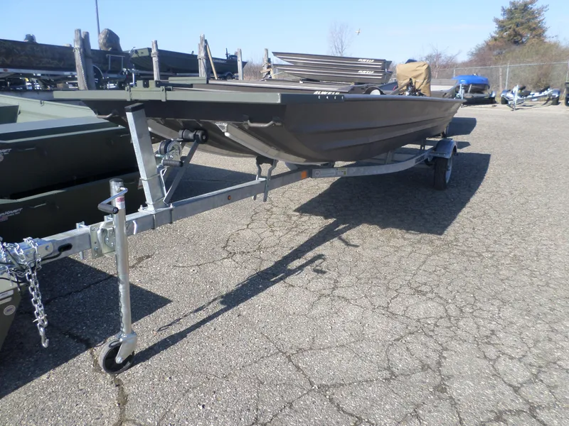 Slide: The Image of 2025 Alweld 1542 Jon boat on trailer in outdoor lot. - 2