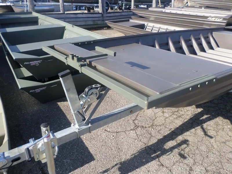 Slide: The Image of 2025 Alweld 1542 Jon boat on trailer, displayed outdoors. - 3