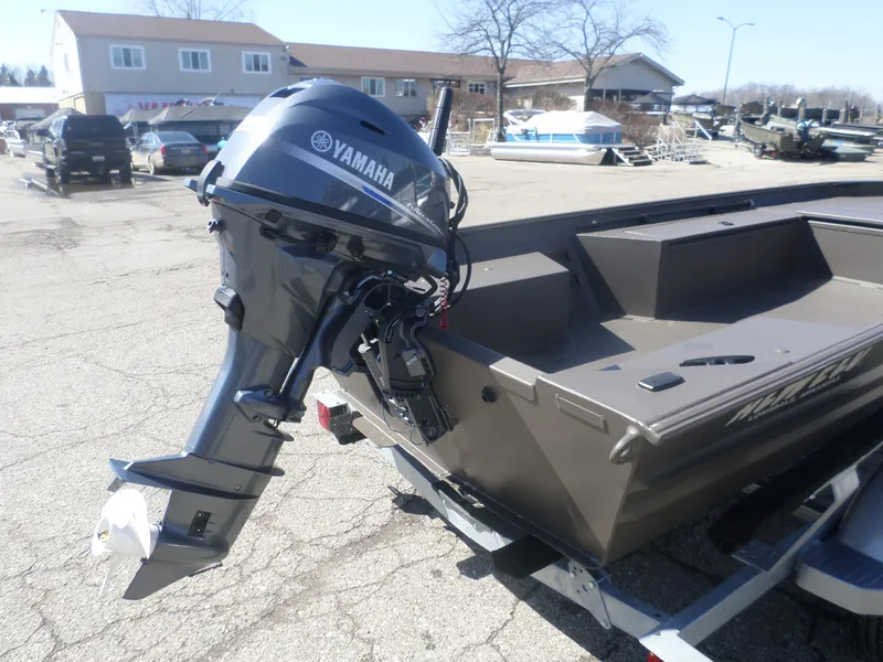 Slide: The Image of 2025 Alweld 1548 VV Marsh Tiller boat with Yamaha outboard motor in a parking lot. - 4