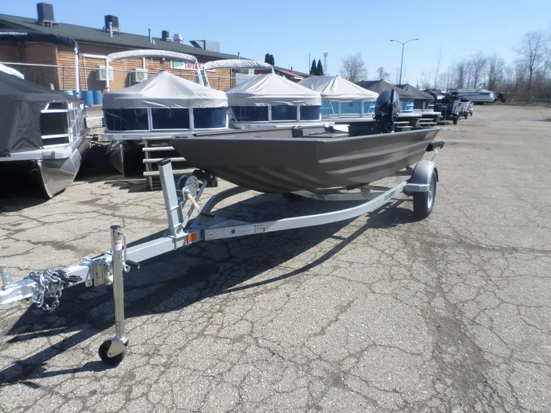 Slide: The Image of 2025 Alweld 1548 VV Marsh Tiller boat on trailer in outdoor lot. - 6