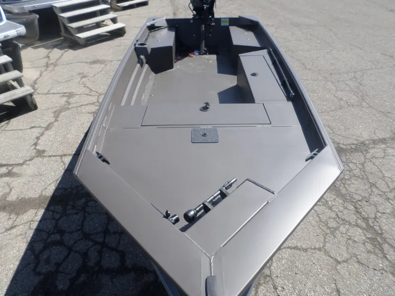 Slide: The Image of 2025 Alweld 1548 VV Marsh Tiller boat, gray deck, parked on concrete surface. - 7