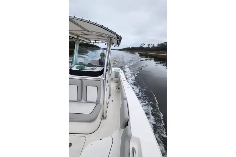 Slide: The Image of 2022 Sea Fox 228 Commander cruising on a calm waterway. - 11