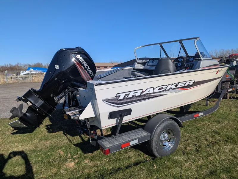 Slide: The Image of 2019 Tracker Pro Guide V-165 WT boat with Mercury outboard engine on trailer. - 5