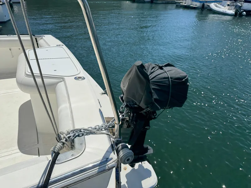 Slide: The Image of 2003 Mediterranean 38 Convertible boat with covered outboard motor at marina. - 15